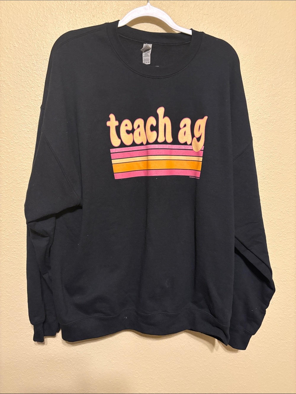 Gildan Black Women’s Sweatshirt with Pink and Orange 'teach ag' Graphic